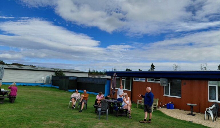 Rob Hender explaining the great wave cloudscapes to some visitors (Jill Harmer)