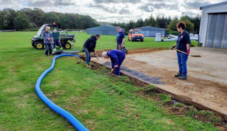 Installing drainage round the hangar (Mike Horwood)